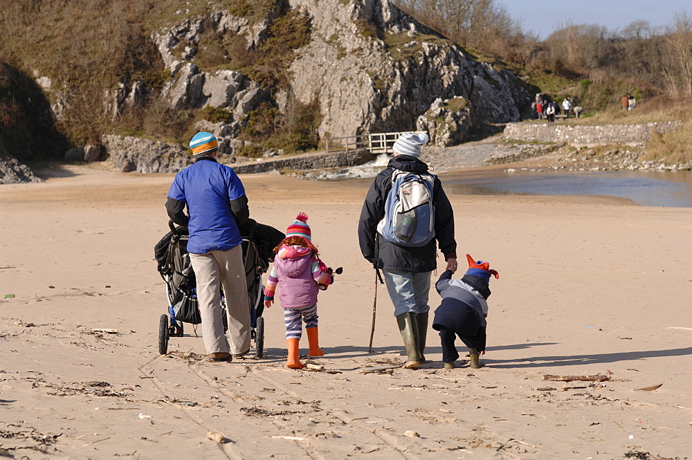 Two mothers pushing pushchairs and children on beach, Broad Haven South, Stackpole, Pembrokeshire, Wales, UK, Europe