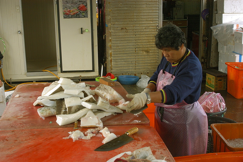 Woman processing whale shark meat (tofu shark), Suao, Taipei, Taiwan, Asia