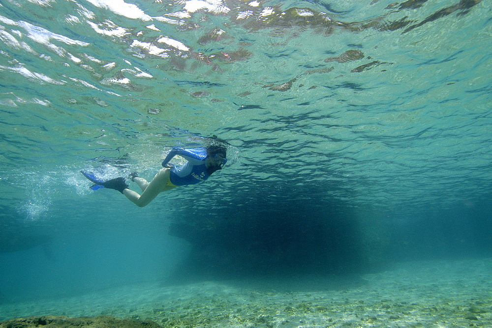 Free diver swims over sand flat, Verde Island, Philippines, Southeast Asia, Asia