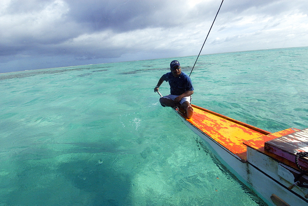 Marshalhese men steering a traditional outrigger canoe, Ailuk atoll, Marshall Islands, Pacific