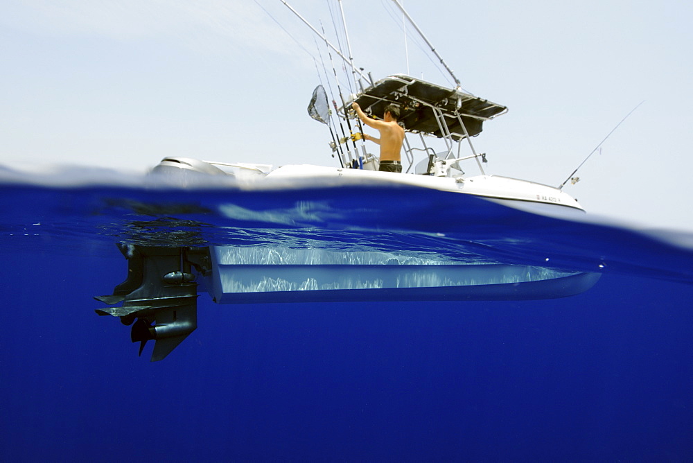 Split image of 21 ft catamaran in open ocean, Kailua-Kona, Hawaii, United States of America, Pacific