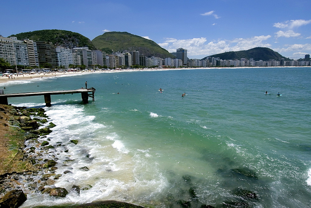 Surfers at Copacabana beach, Rio de Janeiro, Brazil, South America