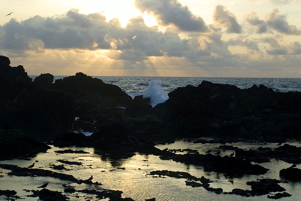 Waves braking near tide pool at dawn, St. Peter and St. Paul's rocks, Brazil, South America