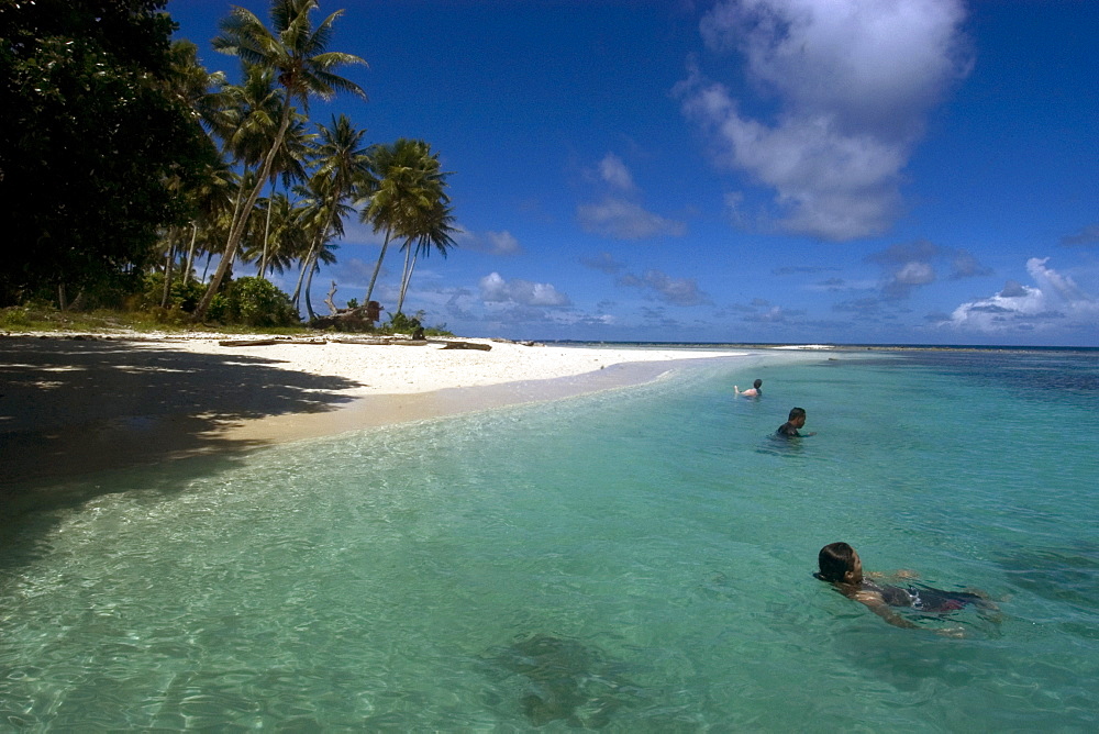 People enjoy the sheltered island beach in Truk lagoon, Chuuk, Federated States of Micronesia, Caroline Islands, Micronesia, Pacific Ocean, Pacific