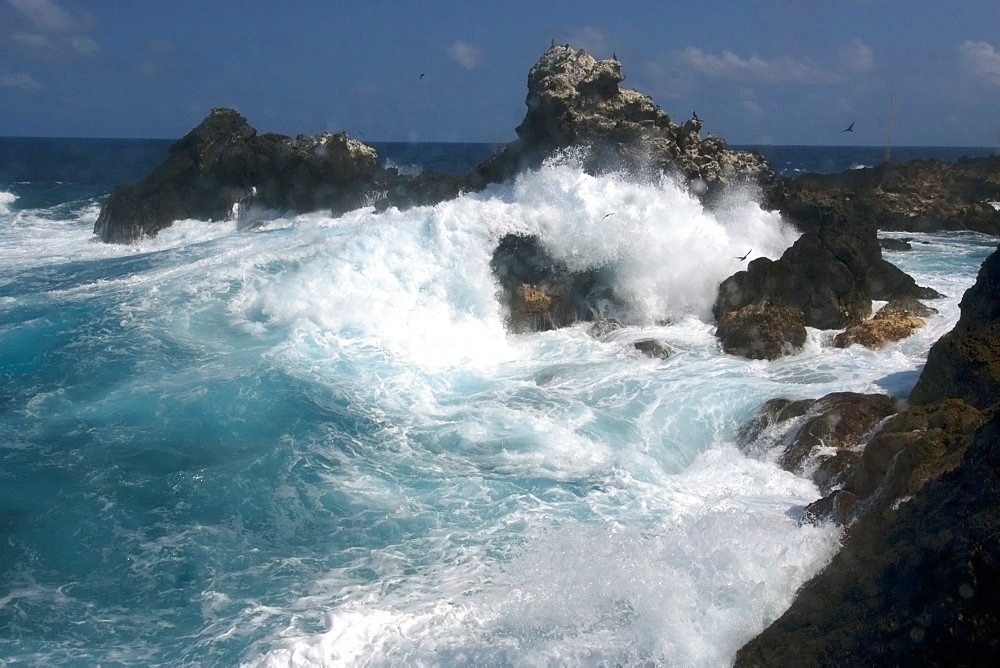 Wave crashing over rocks,  St. Peter and St. Paul's rocks, Brazil, South America