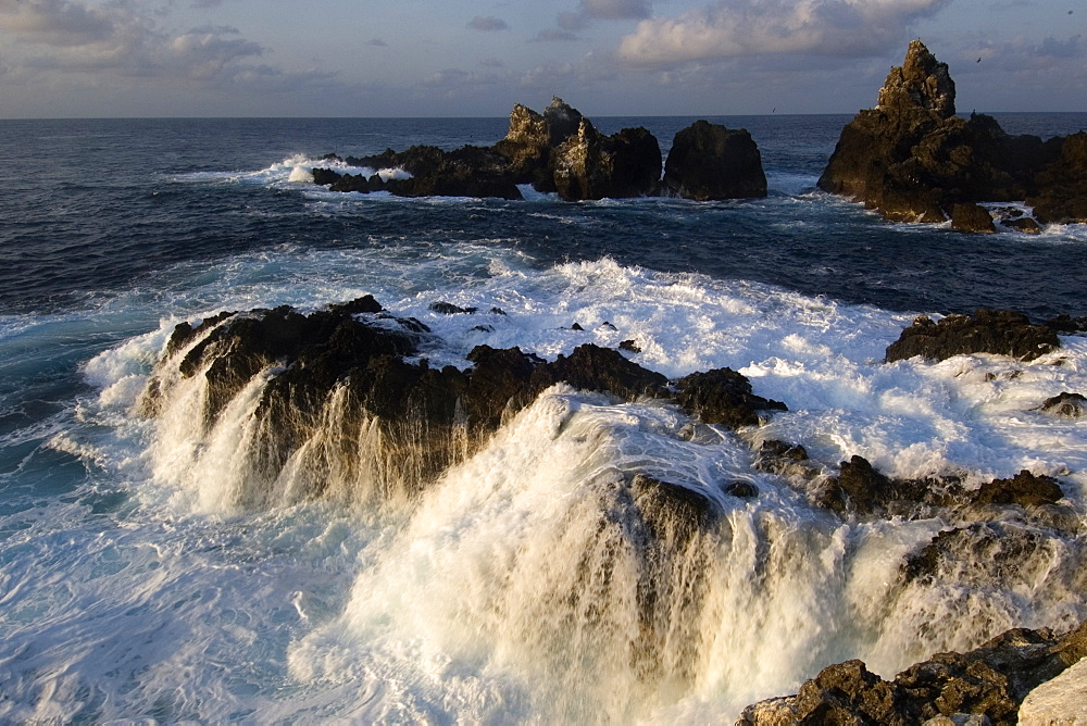 Wave crashing over rocks,  St. Peter and St. Paul's rocks, Brazil, South America