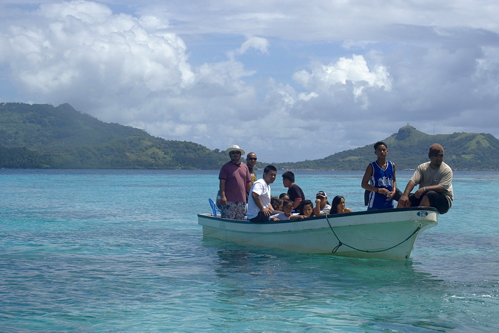 Boat with local family approaches island for a day trip, Truk lagoon, Chuuk, Federated States of Micronesia, Caroline Islands, Micronesia, Pacific Ocean, Pacific