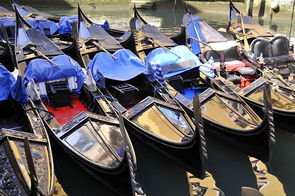 Gondolas moored on the canals in Venice, UNESCO World Heritage Site, Veneto, Italy, Europe