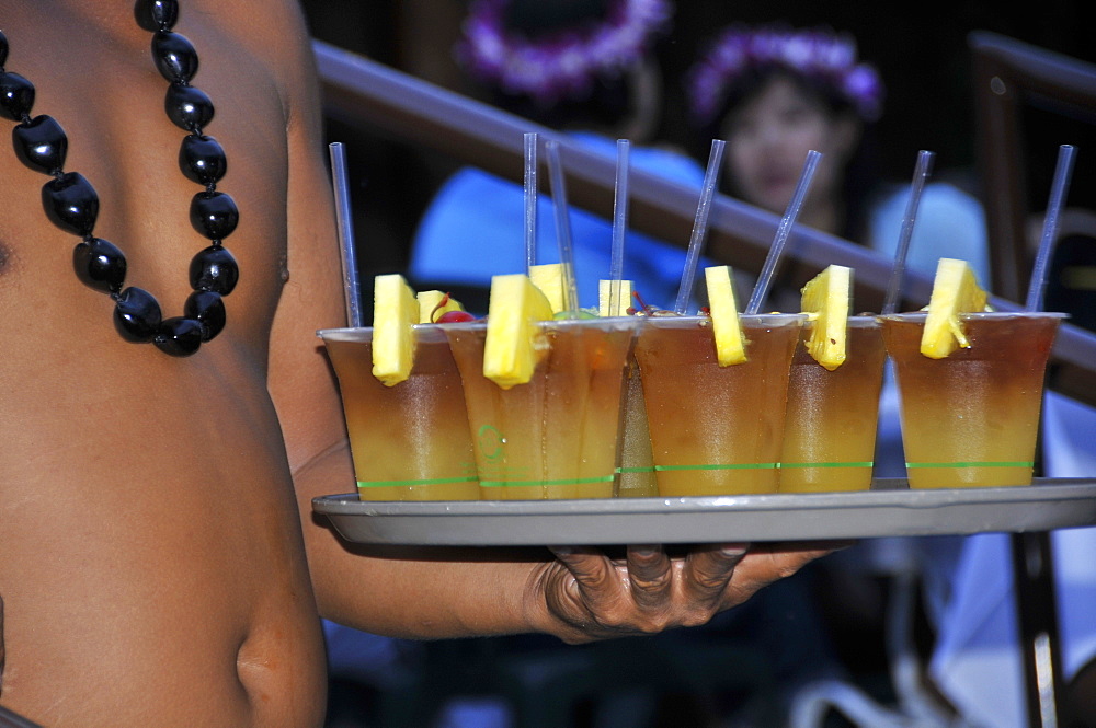 Waiter brings tray of Mai Tai cocktails, Kona Village Resort Luau, Kailua-Kona, Big Island, Hawaii, United States of America, Pacific