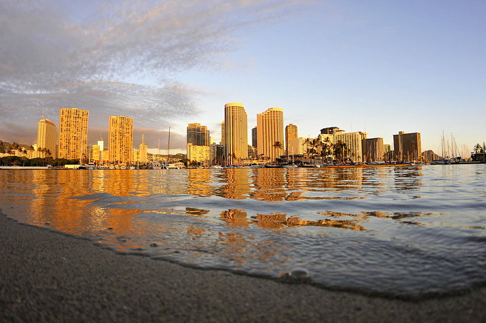 Buildings and hotels at Waikiki waterfront at dusk, Ala Moana Beach Park, Waikiki, Oahu, Hawaii, United States of America, Pacific