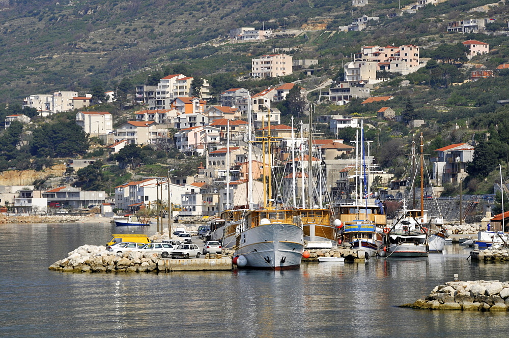 Boats, harbour and cliffs, coastal town of Omis, Croatia, Europe