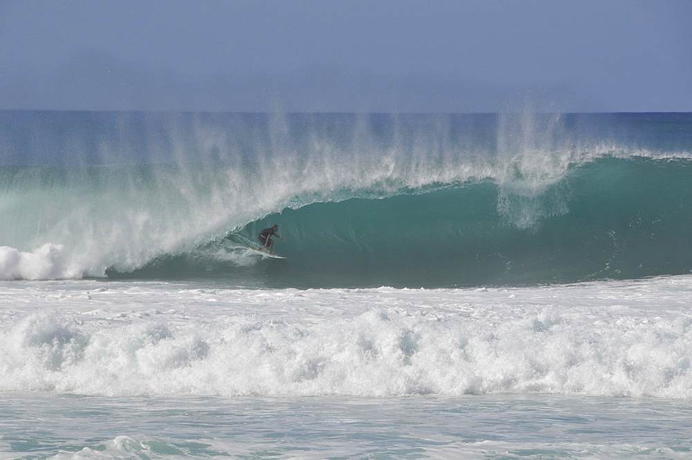 Surfers riding famous barrel waves, Oahu, Hawaii, United States of America, Pacific