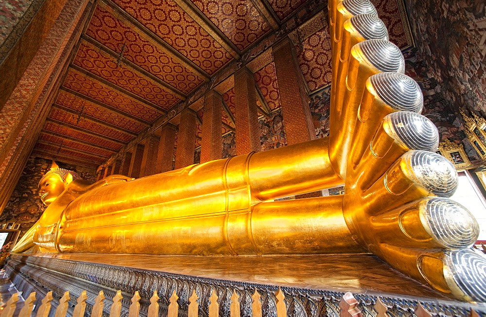 Wat Pho, the Temple of the Reclining Buddha.  Bangkok, Thailand, Asia.   Worlds Largest Reclining Buddha