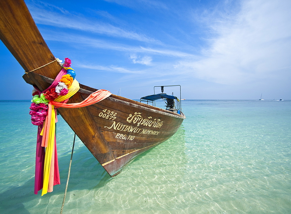 Traditional Thai Long Tail Boat on beach.  Krabi, Thailand, South-East Asia, Asia