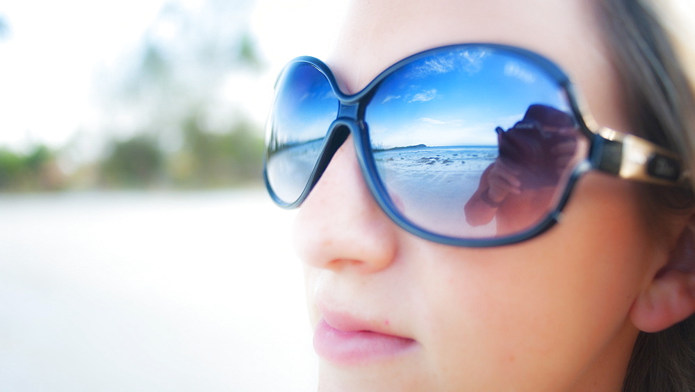 Adult female, on beach, sunglasses.  Bintan Island, Riau Islands, Indonesia 