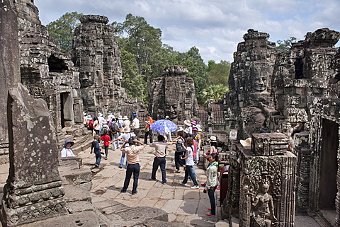 Tourists at The Bayon, Angkor Thom, Angkor, UNESCO World Heritage Site, Siem Reap, Cambodia, Indochina, Southeast Asia, Asia 