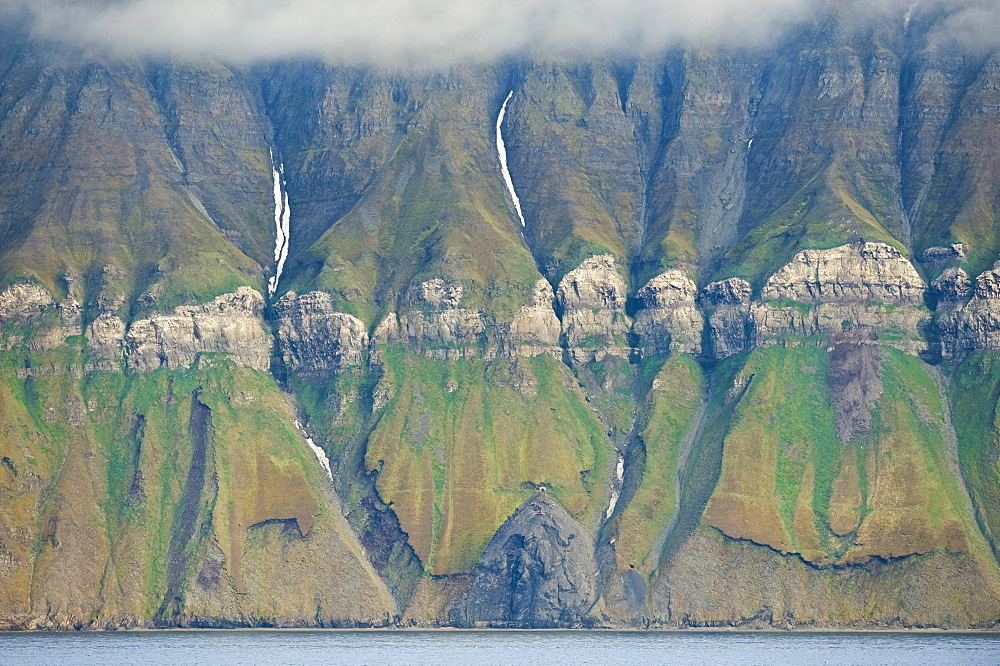 Rock formations on mountain side. Longyearbyen, Svalbard, Norway