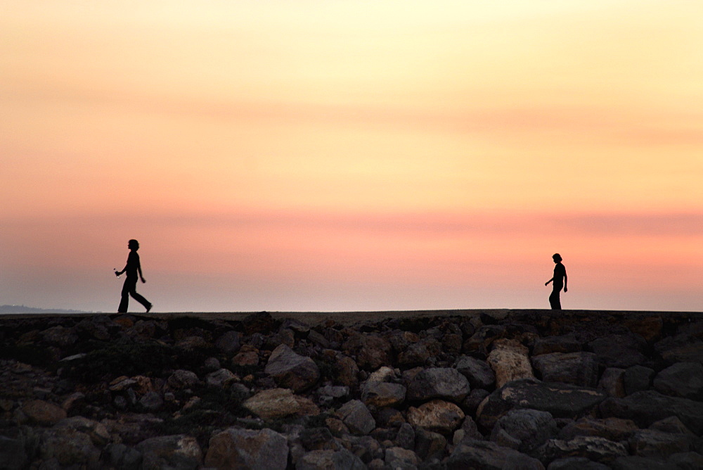 Break wall, beach front, sun set, afternoon, walk