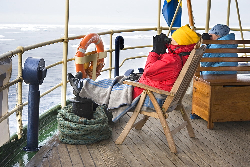 Boat, tourists, arctic cruise, ice breaker, scouting. Longyearbyen, Svalbard, Norway