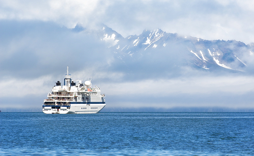 the ship Clipper Odyssey, mountains, snow caped, arfternoon, 27/06/2008, Bogoslov Island (Bering Sea) Russia, Asia 