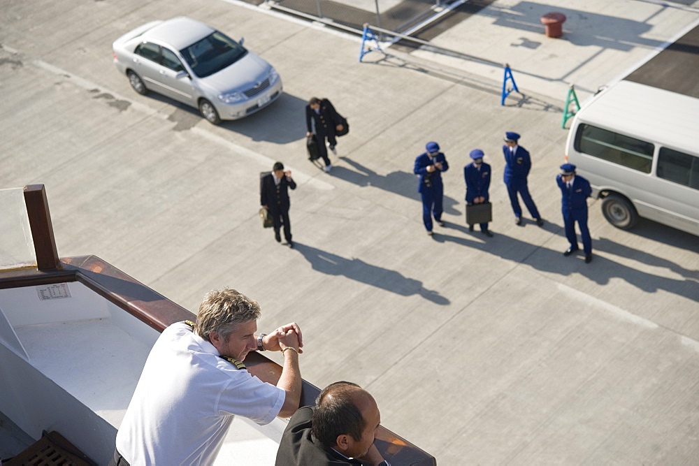 Sakhalin International Port,  Male Captain on board the Clipper Odyssey with Russian Immigration officers, Yuzhno Sakalinsk (Sakhalin island), Russia, Asia