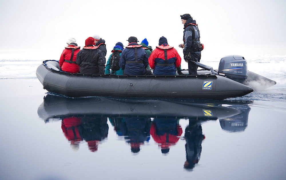 Zodiac, boat, cruise. tourists, arctic sheet ice. Longyearbyen, Svalbard, Norway