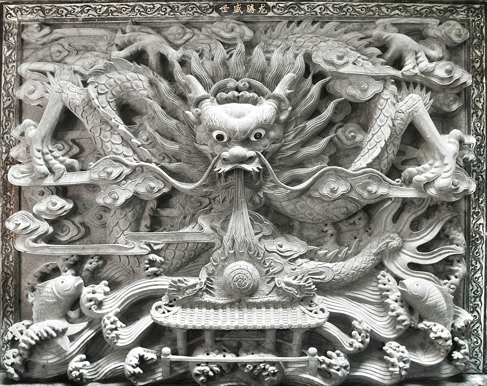 Chinese Temple, Decorative dragon wall carving.  Kuching, Sararwak, Malaysia, Asia