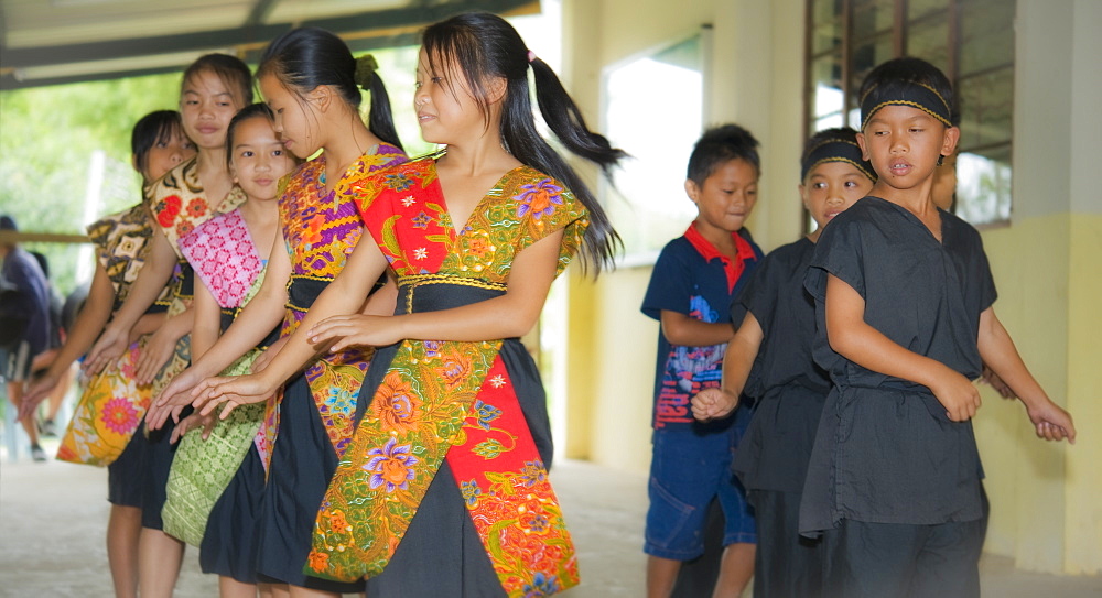 Dusun local children dancing.  Kota Kinabalu, Sabah, Borneo, Asia