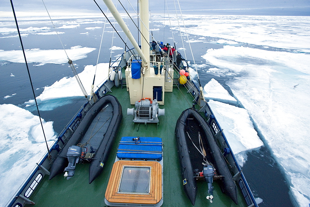 Zodiac, boat, cruise. tourists, arctic sheet ice. Longyearbyen, Svalbard, Norway       (rr)