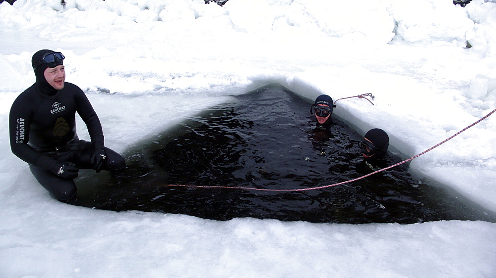 Freediving under the ice in Northern Russia in the White Sea. White Sea, Russia