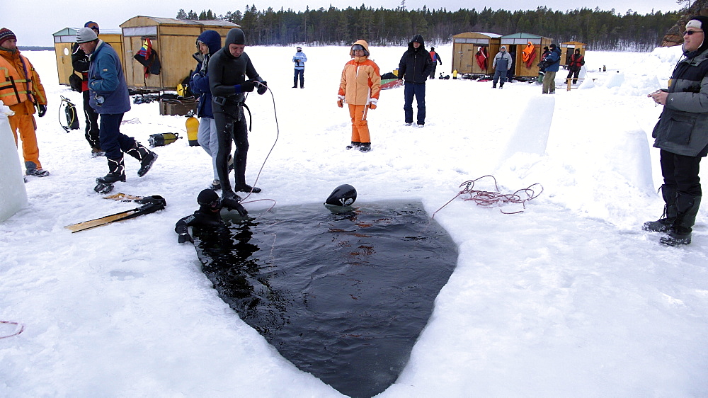 Freediving under the ice in Northern Russia in the White Sea. White Sea, Russia