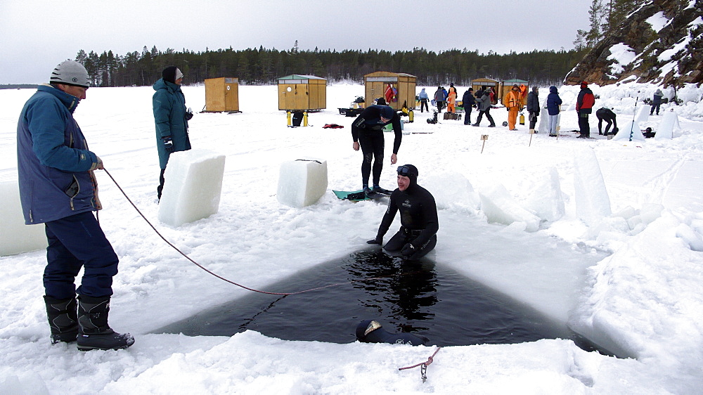 Freediving under the ice in Northern Russia in the White Sea. White Sea, Russia