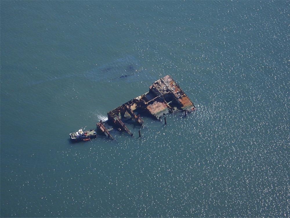 Aerial views of the Napoli sitting off the Devon coastline near Sidmouth and Branscombe. Devon, UK