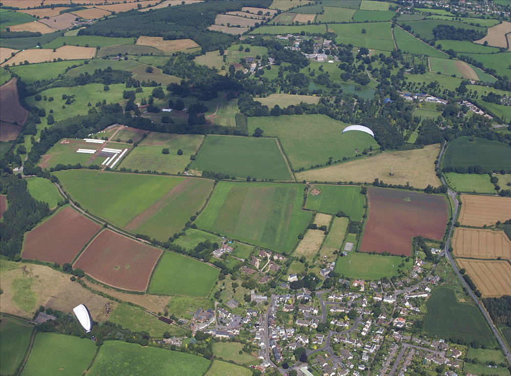 aerial views  of Paramotoring over the countryside in Devon UK