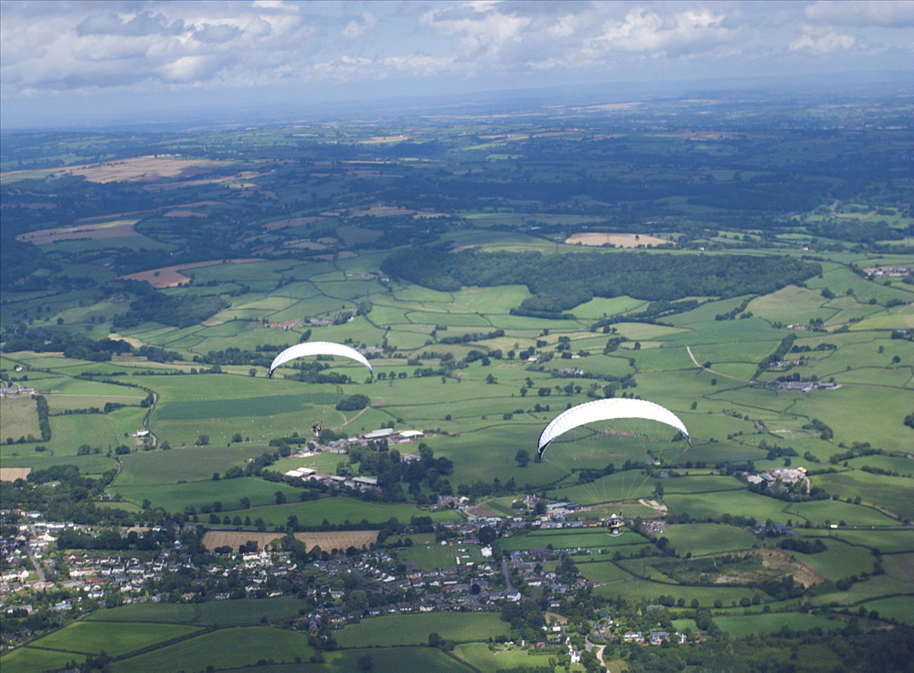 paramotoring over the countryside. Devon. Uk