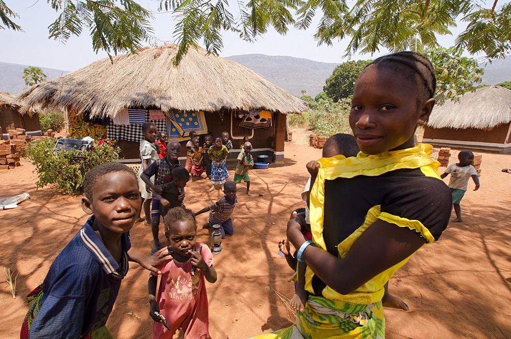 African girl in village with baby, Talpia, Zambia, Africa