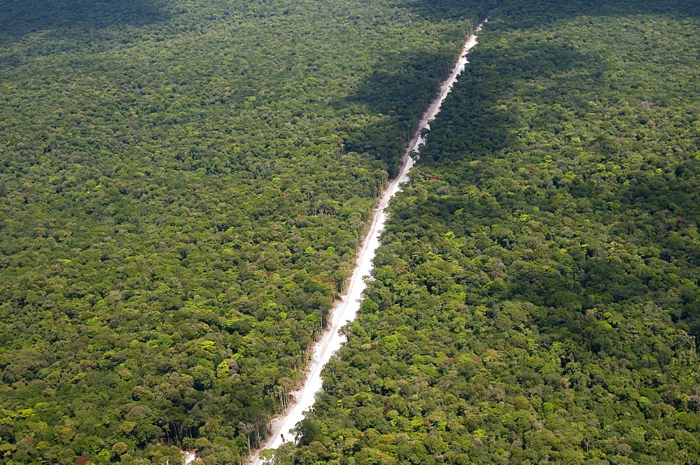 Main highway of Guyana cutting through the rainforest, Guyana, South America