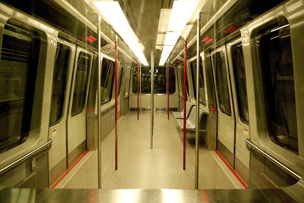 The ultra modern vancouver underground Airport Shuttle, whizzes through the tunnel, sleek and vacant of any human activity. Vanocuver, BC, Canada