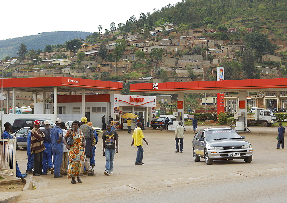 Acting as beacons of Western wealth and power, Petrol stations, usually the cleanest, most colourful and well staffed of any facility in Rwanda, regularly facilitate gatherings. Kigali, Rwanda, East Africa