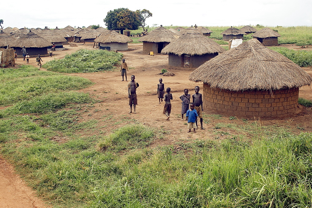 An IDP camp (internally displaced people) in Amuru district of Northern Uganda has been created to accommodate the mass of Ugandan refugees fleeing the LRA (Lords Resistance Army) who are fighting the Ugandan government and its people.  Accommodation are basic mud huts, but always well kept. Amuru, Uganda, East Africa