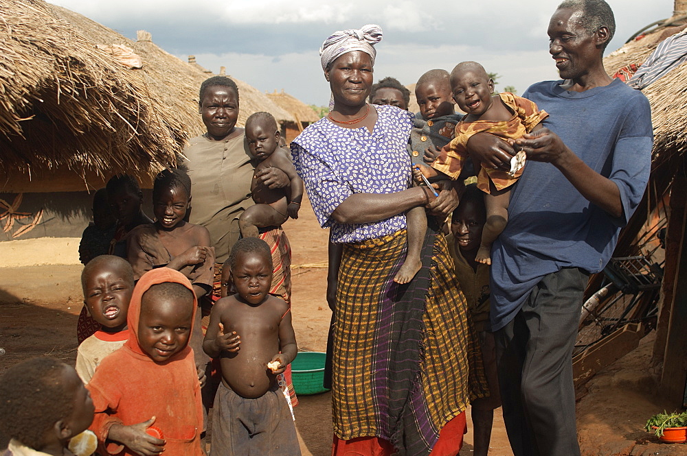 An IDP camp (internally displaced people) in Te-Tugu district of Northern Uganda has been created to accommodate the mass of Ugandan refugees fleeing the LRA (Lords Resistance Army) who are fighting the Ugandan government and its people.  Children are plentiful in these camps and are far safer here than neighbouring villages. Te-Tugu, Uganda, East Africa