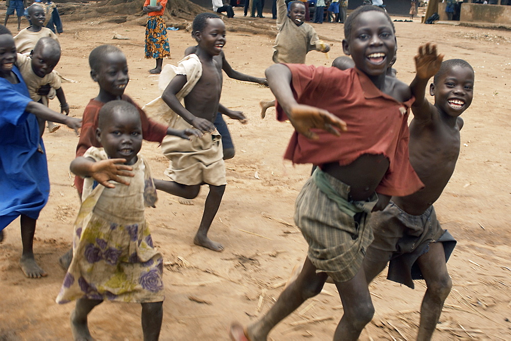 An IDP camp (internally displaced people) in Amuru district of Northern Uganda has been created to accommodate the mass of Ugandan refugees fleeing the LRA (Lords Resistance Army) who are fighting the Ugandan government and its people.  With little to do for the children, foreign visitors are a welcome distraction and they are really happy to see you. Amuru, Uganda, East Africa