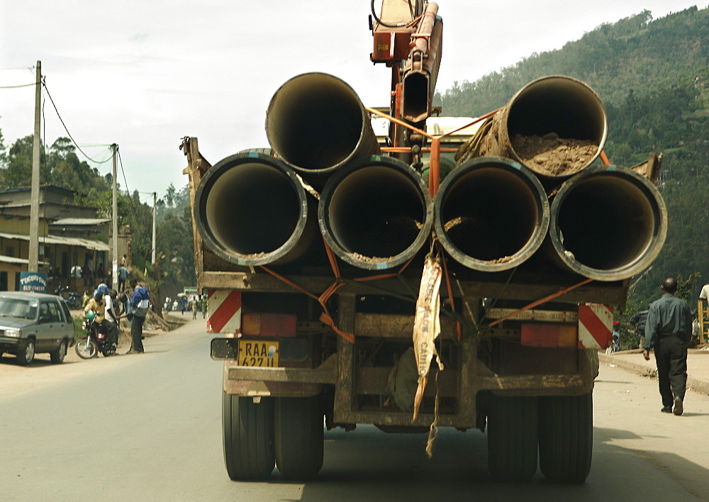 Construction lorry loaded with materials for pipe work.  Kigali, Rwanda. Kigali, Rwanda, East Africa