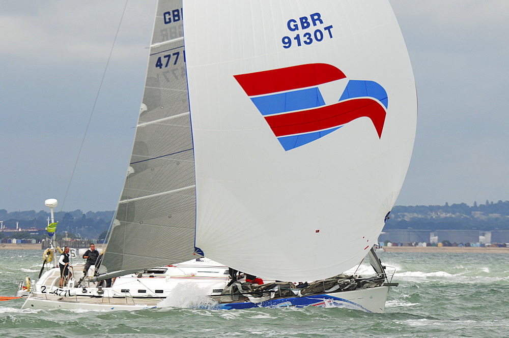 Action dropping the Spinnaker at Skandia Cowes Week 2008 Finish Line