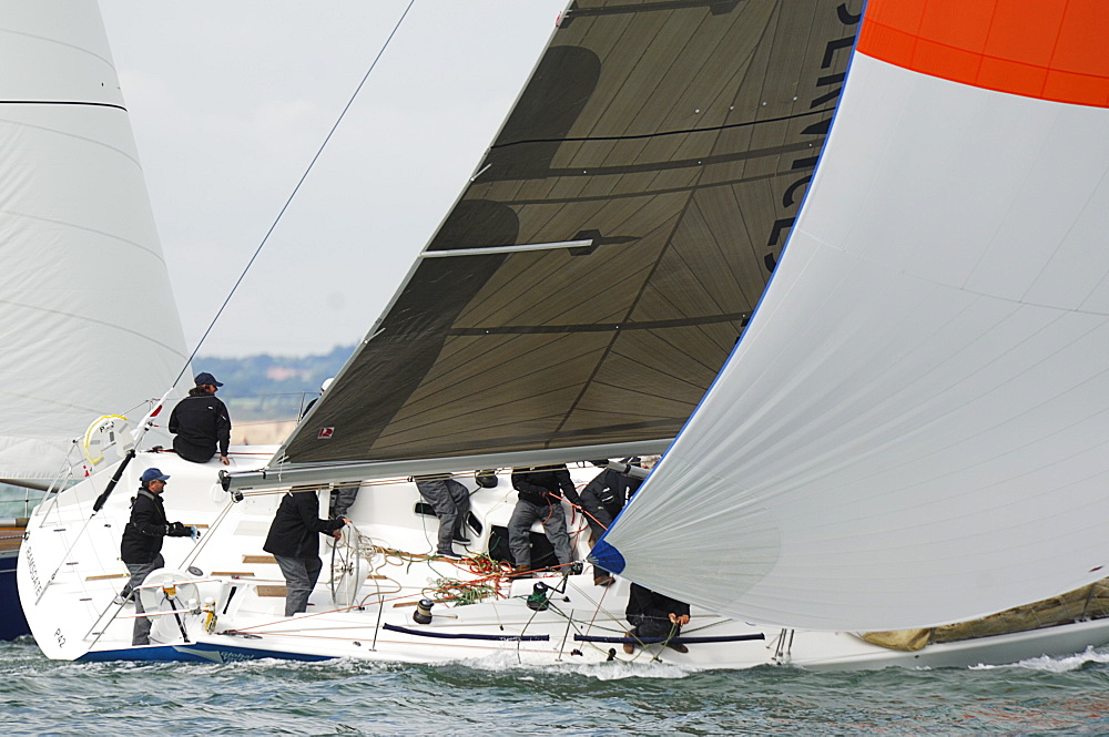 Action dropping the Spinnaker at Skandia Cowes Week 2008 Finish Line