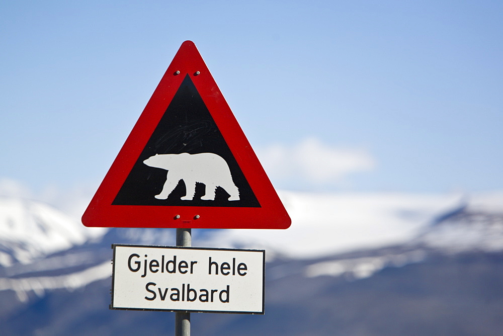 A view of a polar bear warning sign just outside the town of Longyearbyen on the west side of  Spitsbergen Island in the Svalbard Archipelago in the Barents Sea, Norway. 