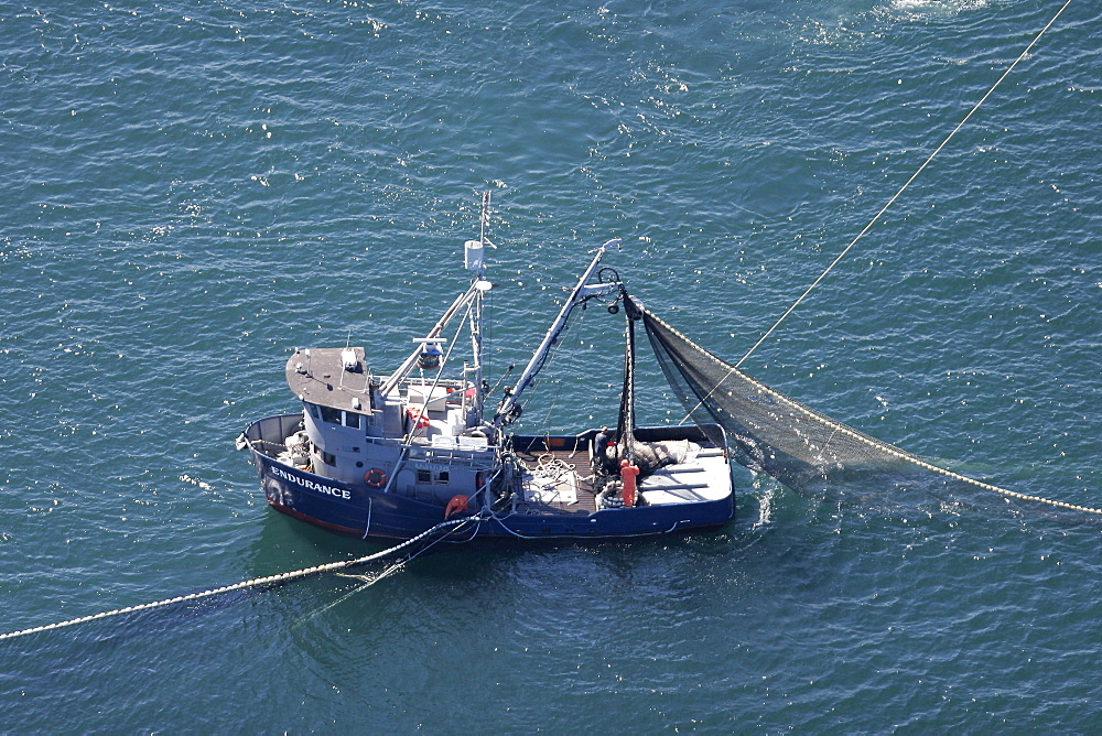 Aerial view of the purse-seiner fishery for salmon off Point Augustus, Chichagof Island, Southeast Alaska, USA. Closing the purse.