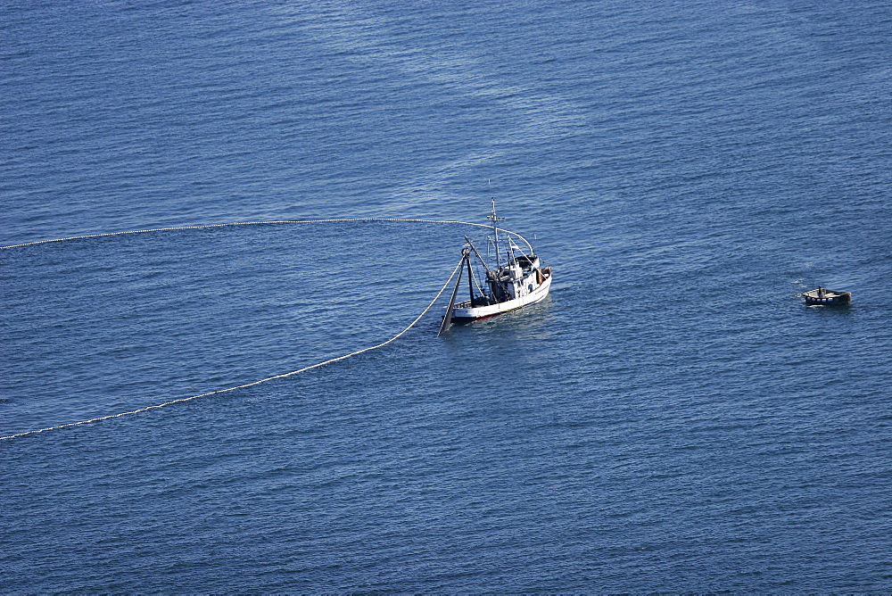 Aerial view of the purse-seiner fishery for salmon off Point Augustus, Chichagof Island, Southeast Alaska, USA. Closing the purse.