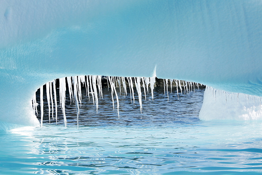 Detail of a melting iceberg (note the dripping icicles) grounded at Heroina Island in the Weddell Sea, Antarctica.