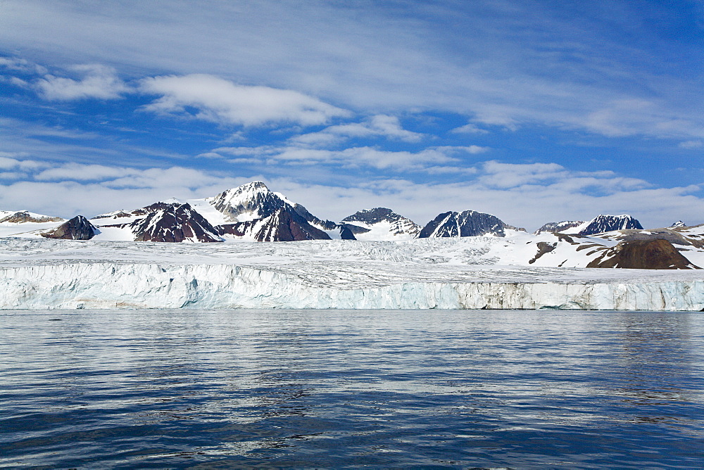 A view of the tidewater glacier in Isbukta (Ice Bay) on the western side of Spitsbergen Island in the Svalbard Archipelago, Barents Sea, Norway